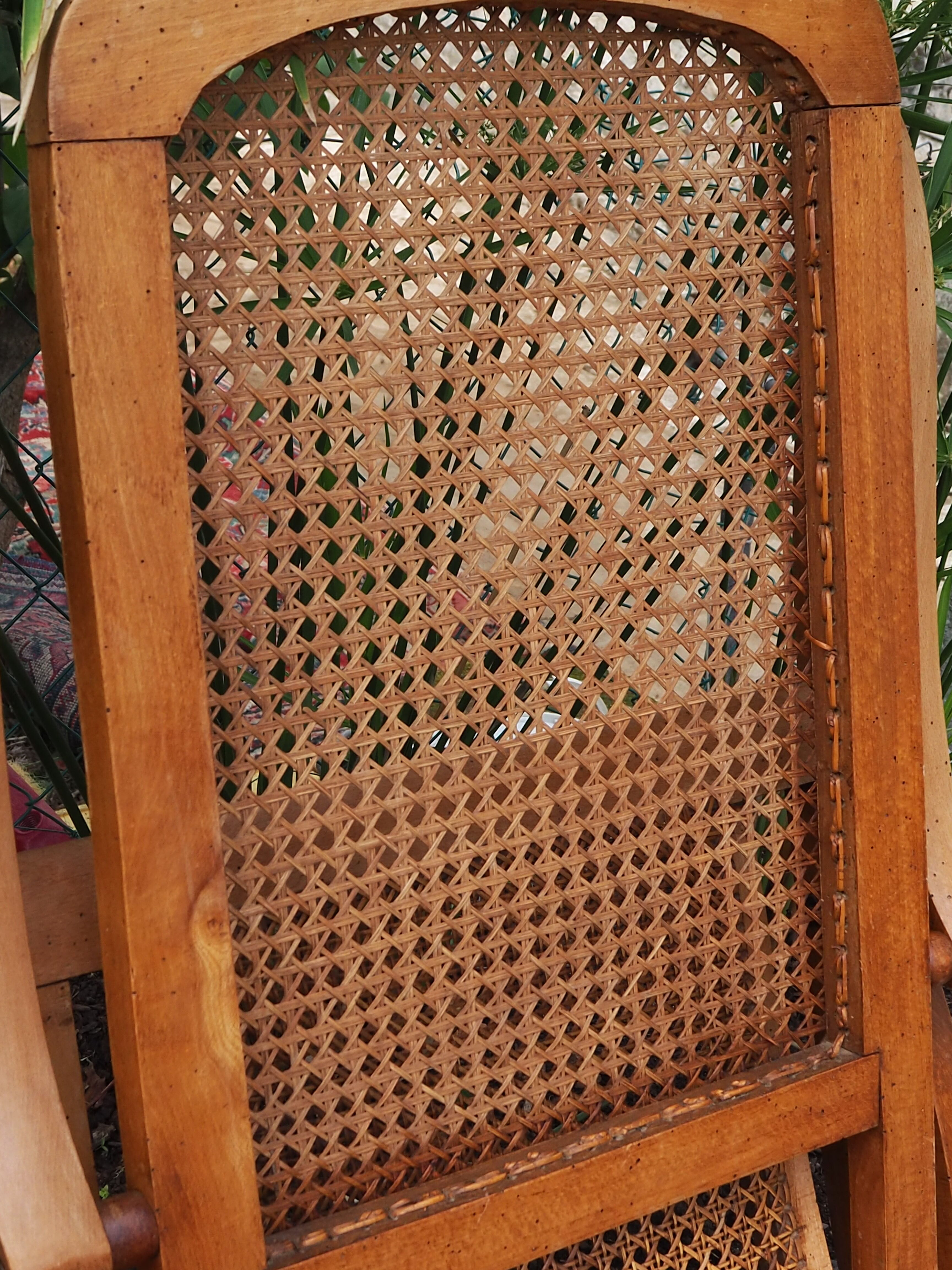 Cane folding armchair in solid wood