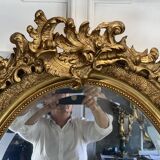 Mirror / oval ice Napoleon III period in wood and gilded stucco louis xv style