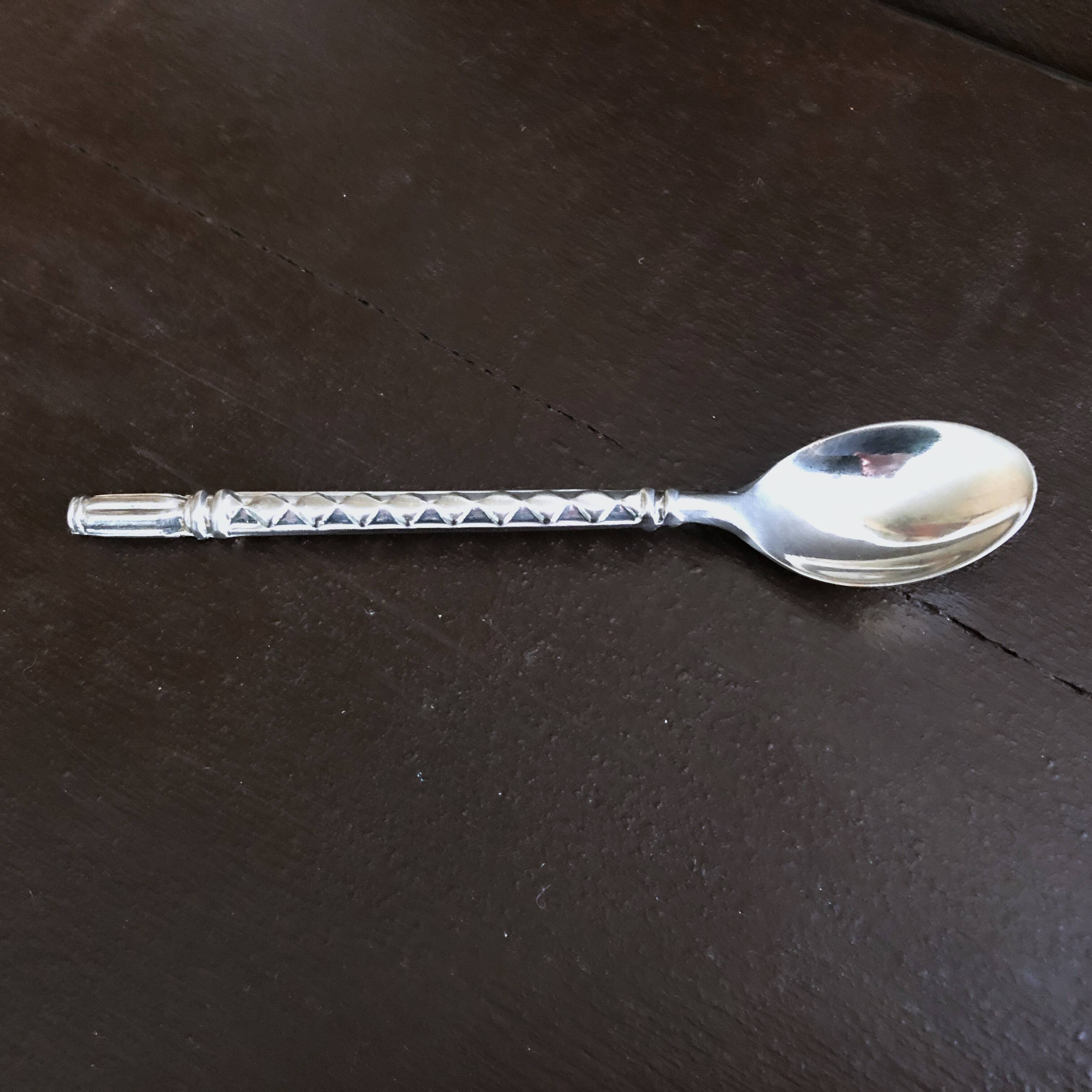 Glass salt and pepper shaker set with vintage serving spoon