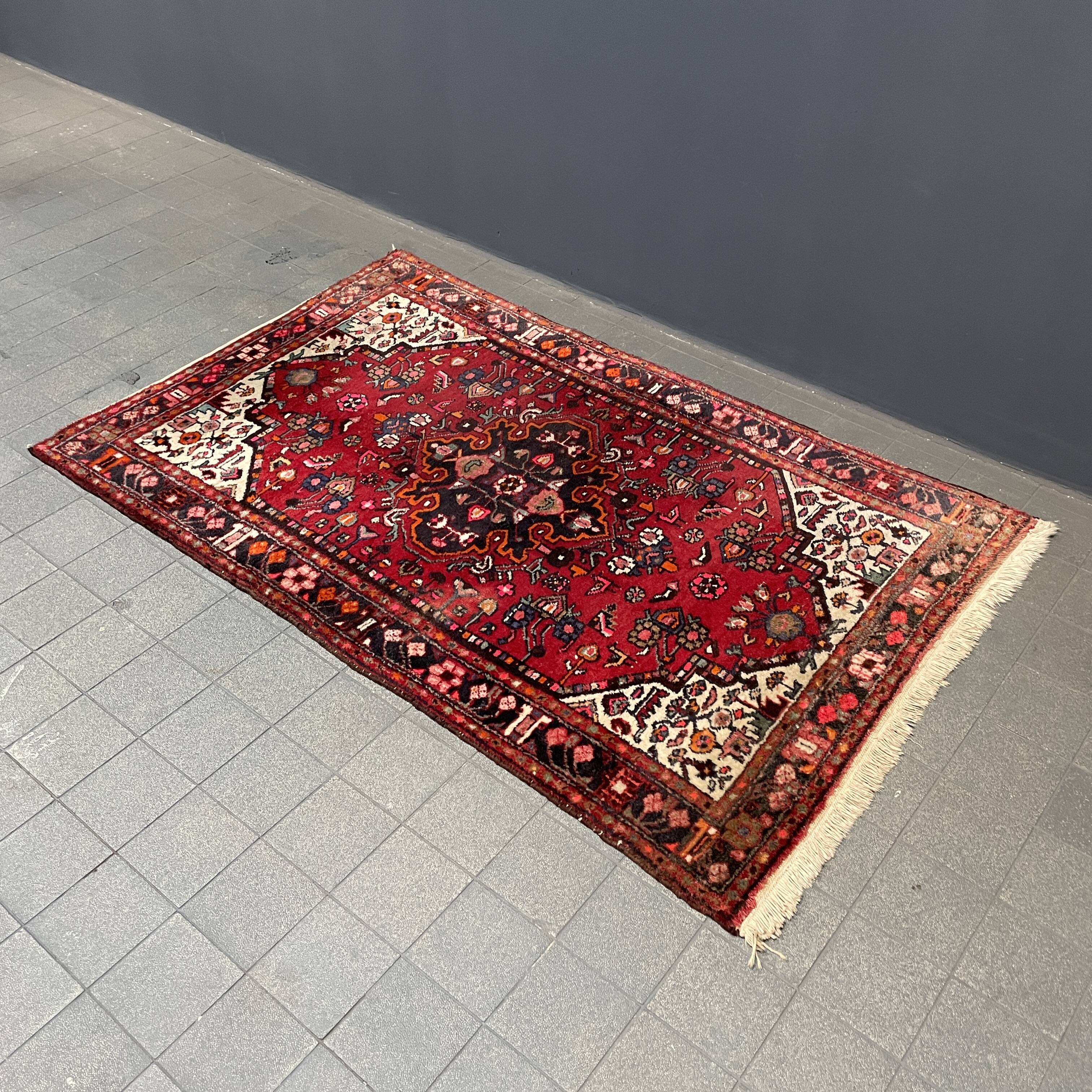 Worn vintage oriental rug or carpet