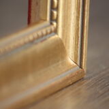 Carved and moulded gilded wood frame