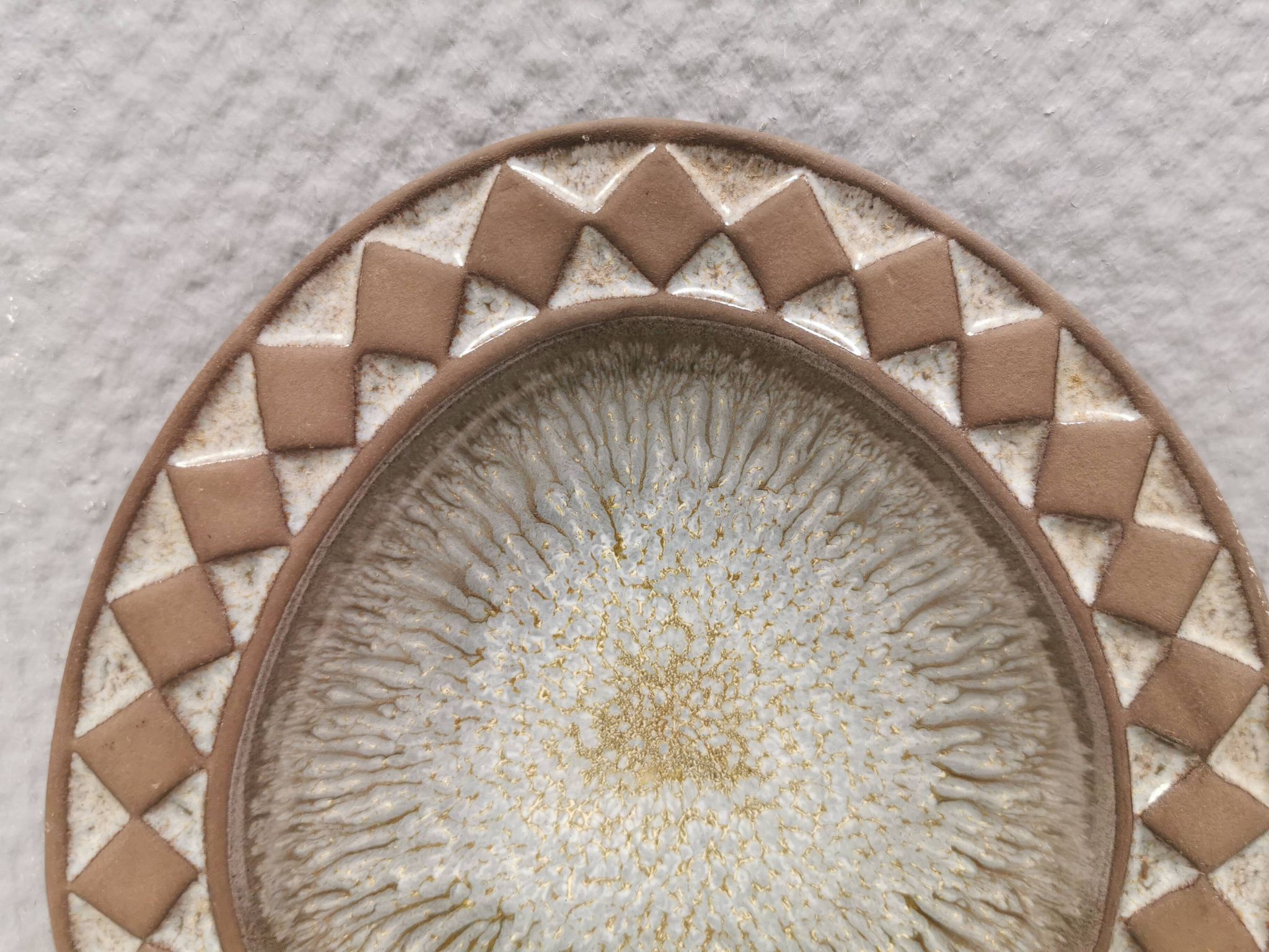Wall-mounted candlestick in grayish colors, Danish and from the 1970s-80s.