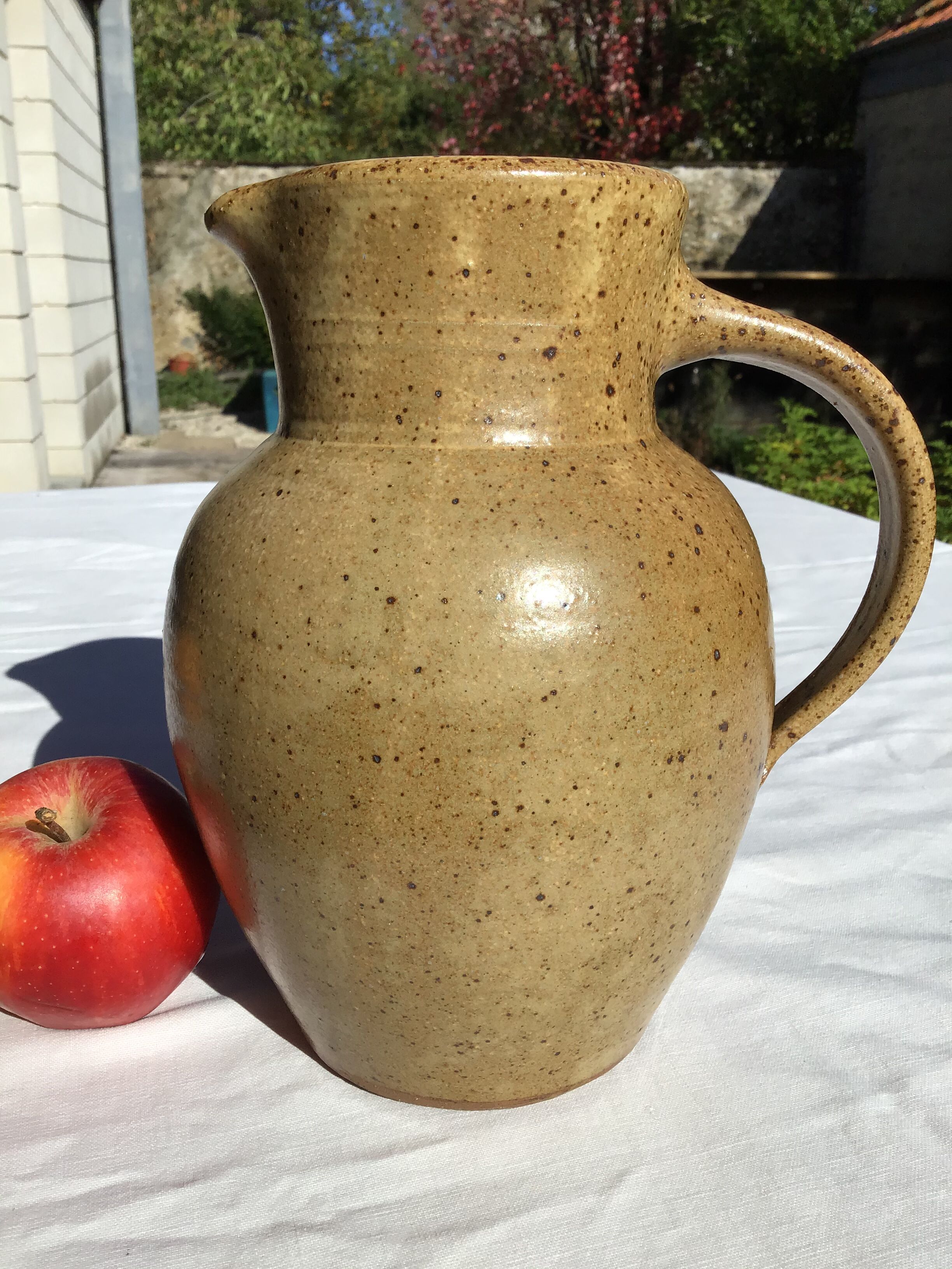 Beige handcrafted speckled sandstone pitcher
