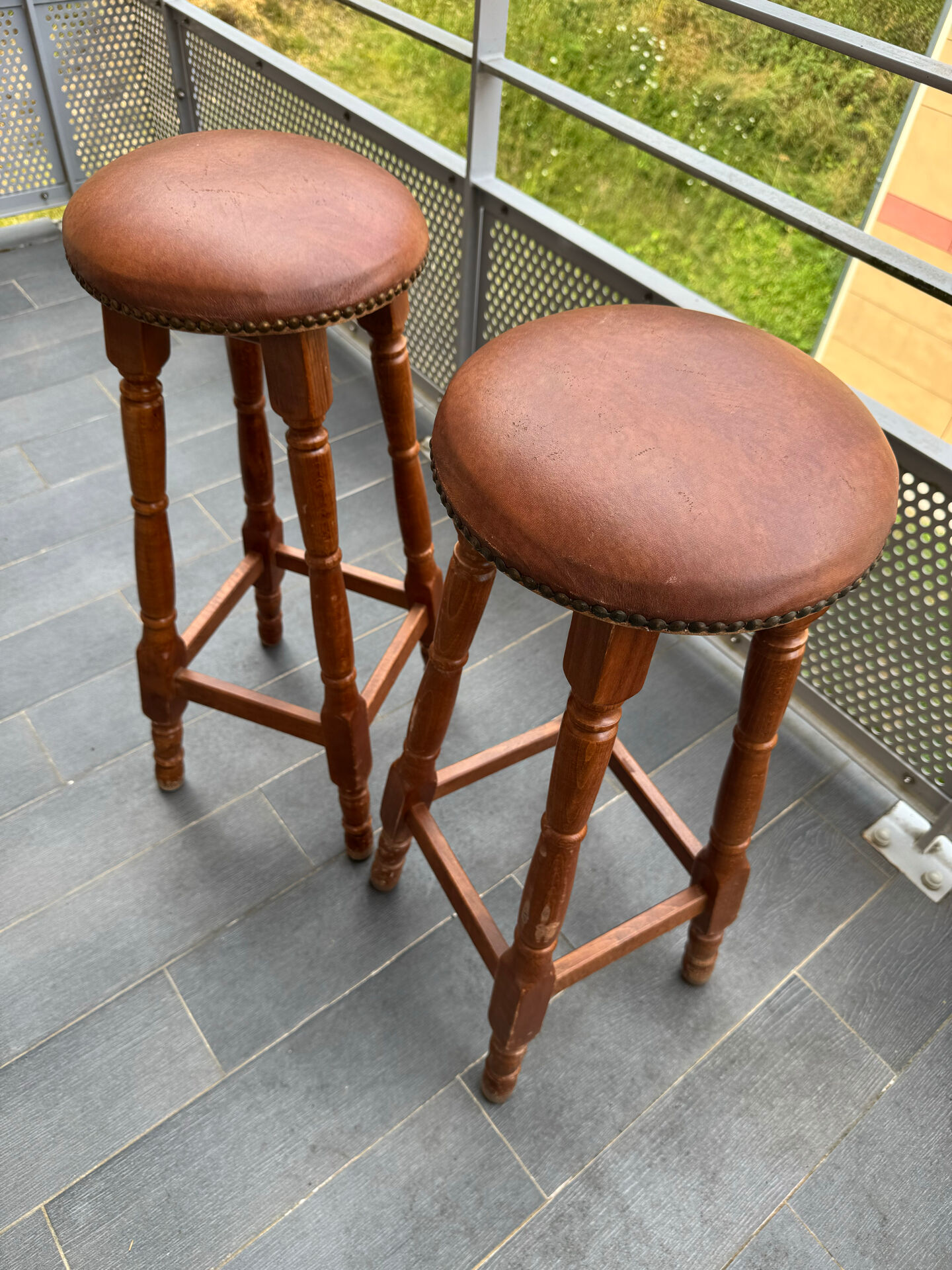 pair of vintage wooden and leather bar stools