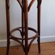 high curved wooden stool of Thonet type, in new condition