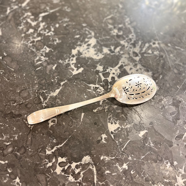 Openwork serving spoon, silver metal