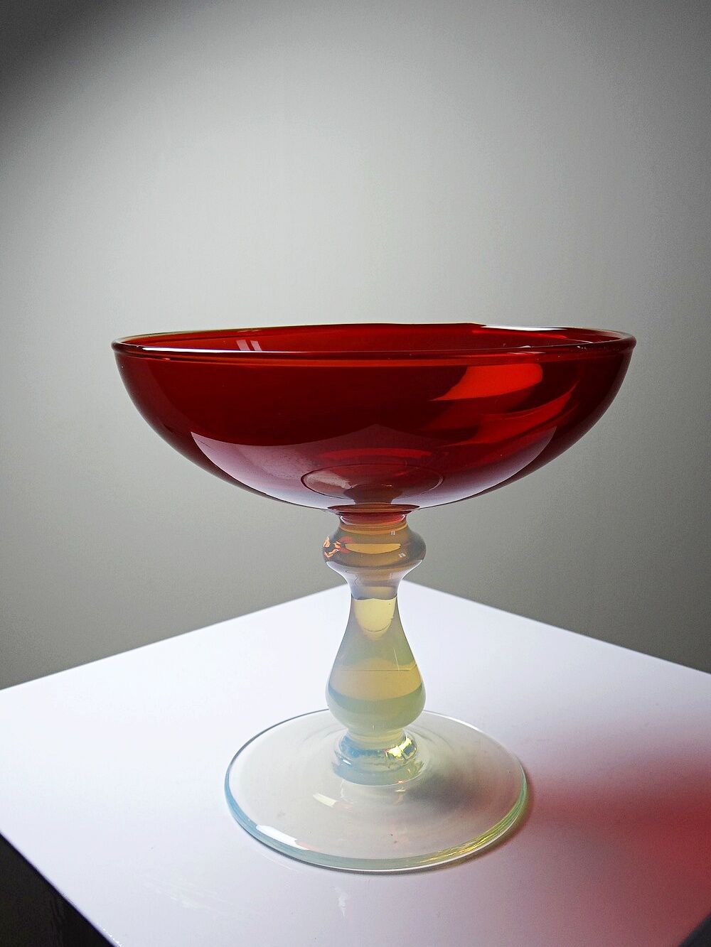 Red Venetian blown glass coupe on a foot with opaline and vintage soap bubble.