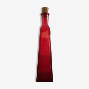 Red glass vial with cork stopper