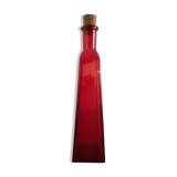 Fiole en verre de couleur rouge avec bouchon en liège