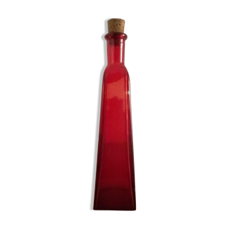 Fiole en verre de couleur rouge avec bouchon en liège