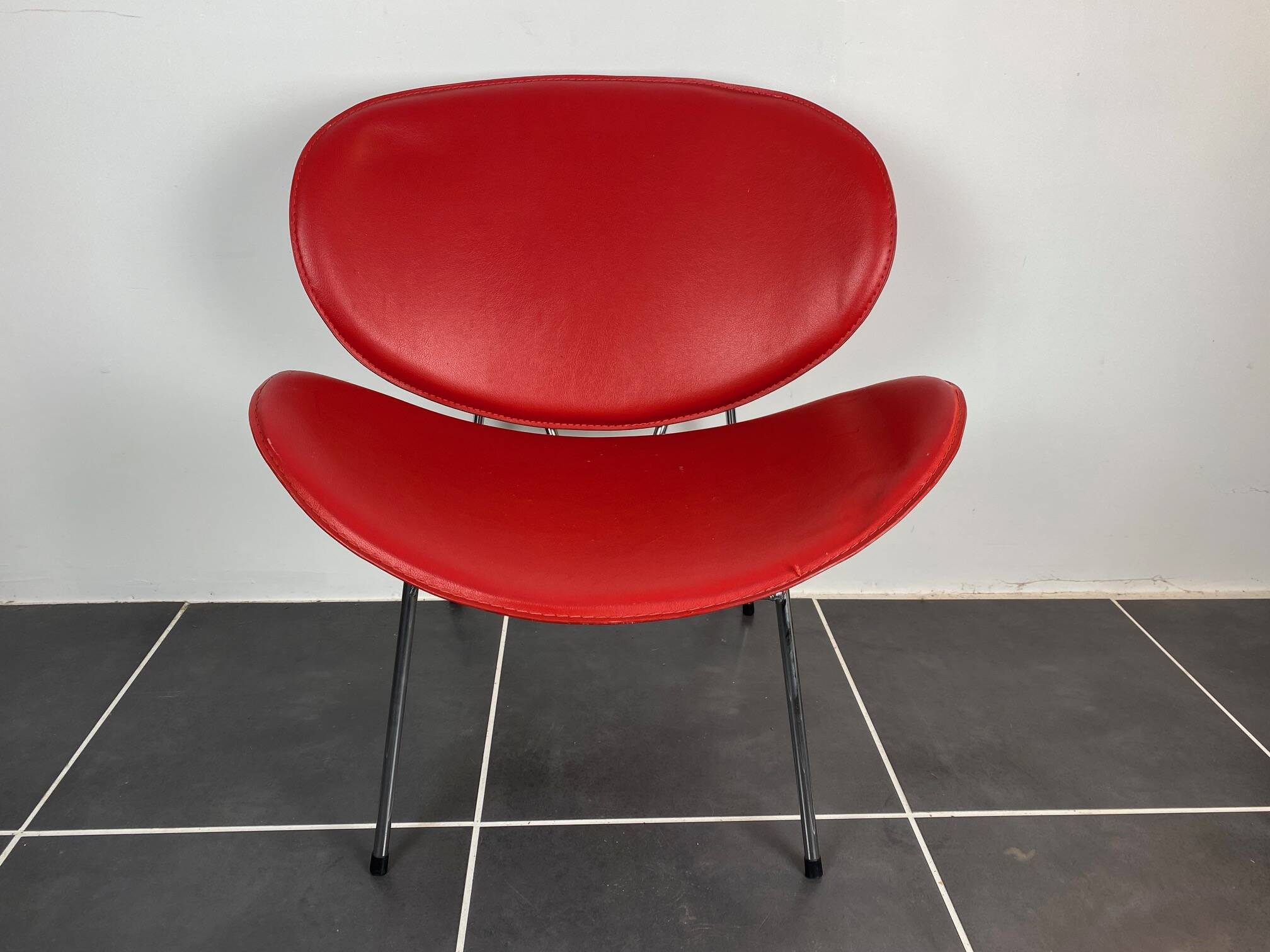 Red lounge chair in the style of Pierre Paulin 1980.