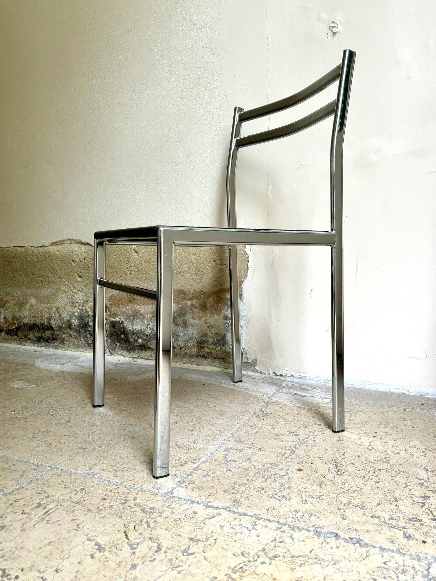 Chair in chrome metal, black wood and canework