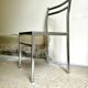 Chair in chrome metal, black wood and canework