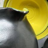 Two pitchers and three Elchinger ceramic bowls black and yellow background 1960