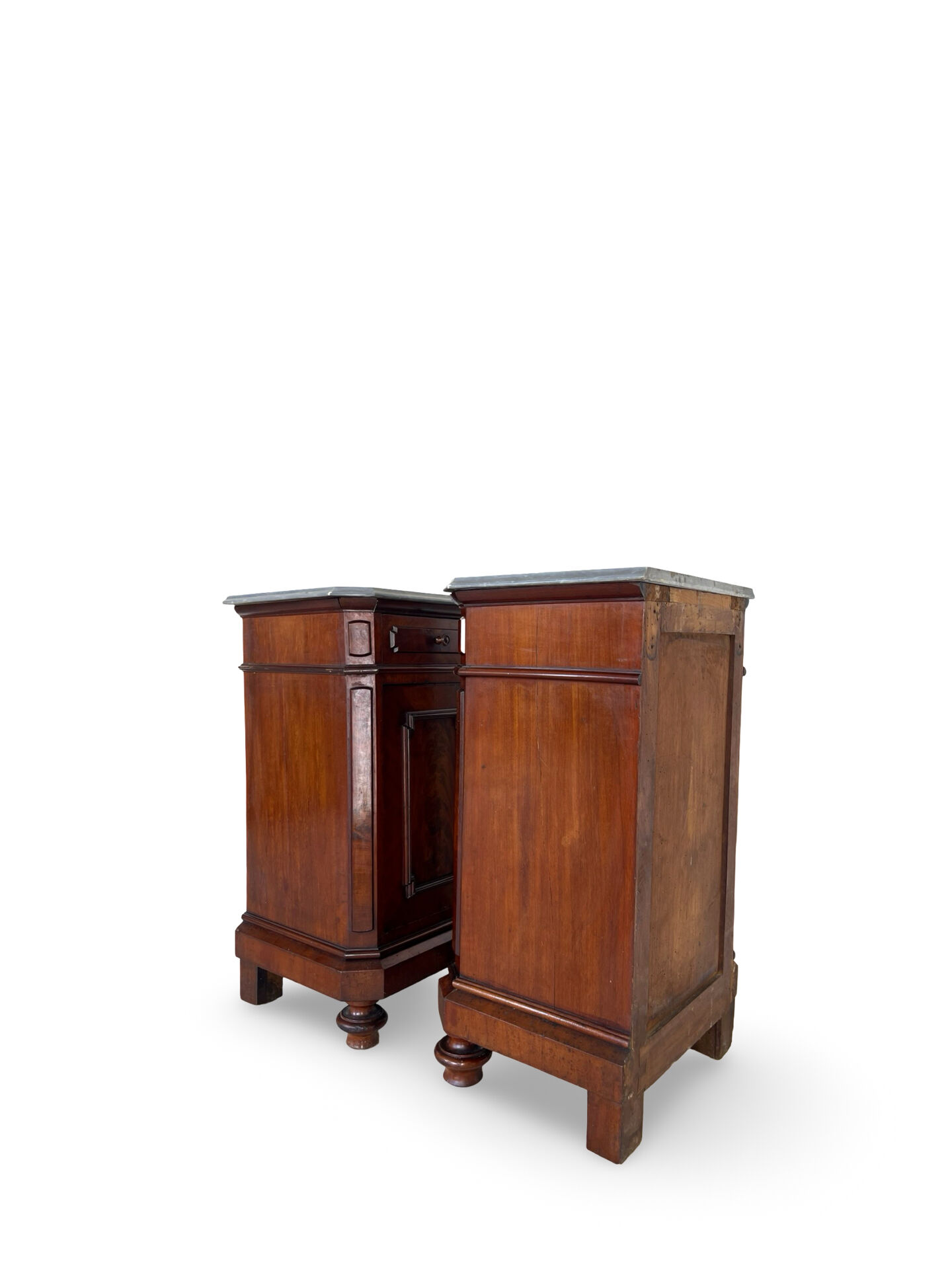 A pair of antique walnut bedside tables from the 1890s.