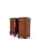 A pair of antique walnut bedside tables from the 1890s.
