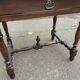 Louis XIV style writing desk in dark solid wood from the 19th century