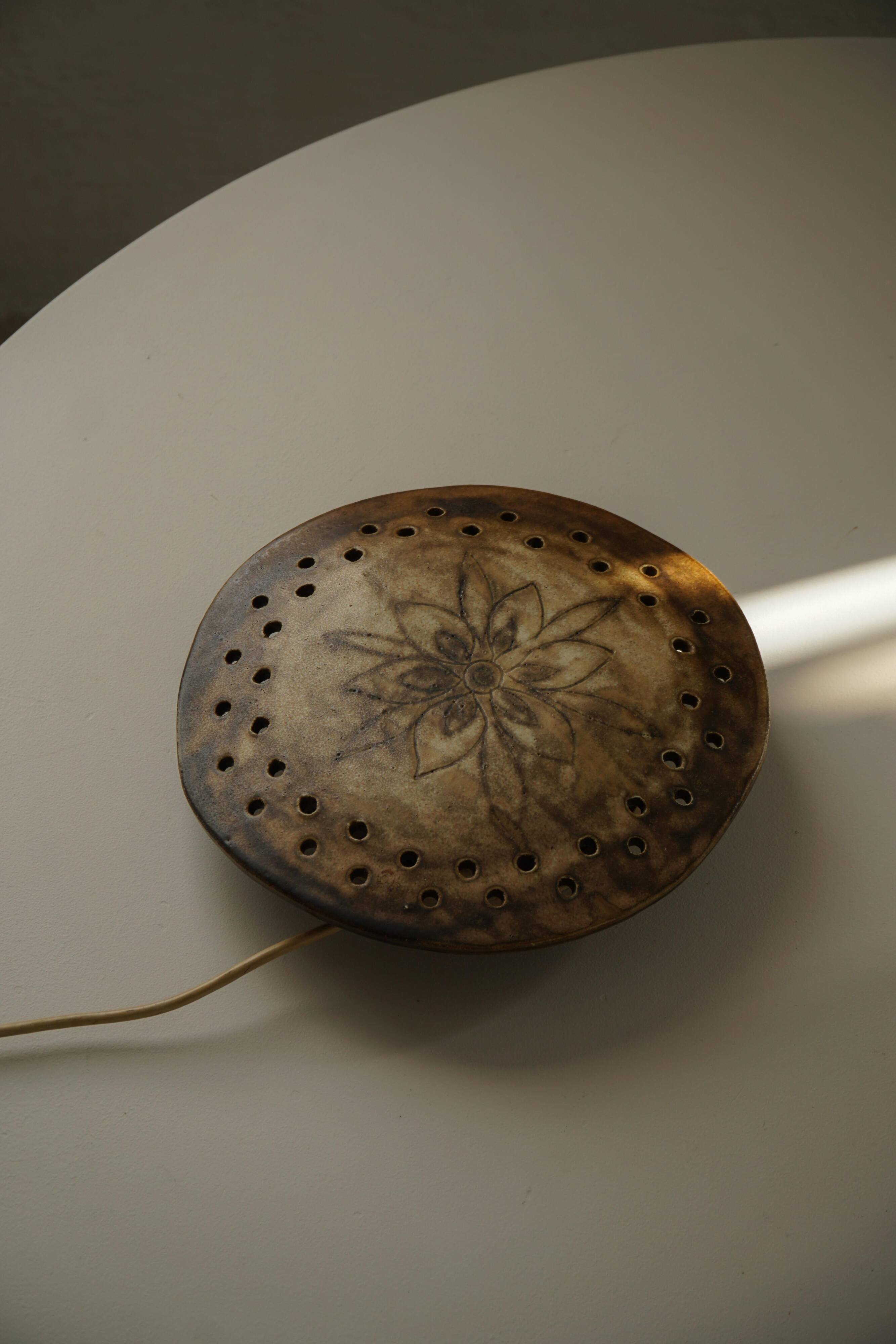 Mid-century sculptural wall light in organic Danish ceramic, 1970.