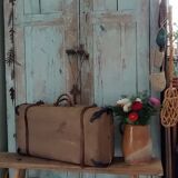 Old suitcase in canvas, wood and metal