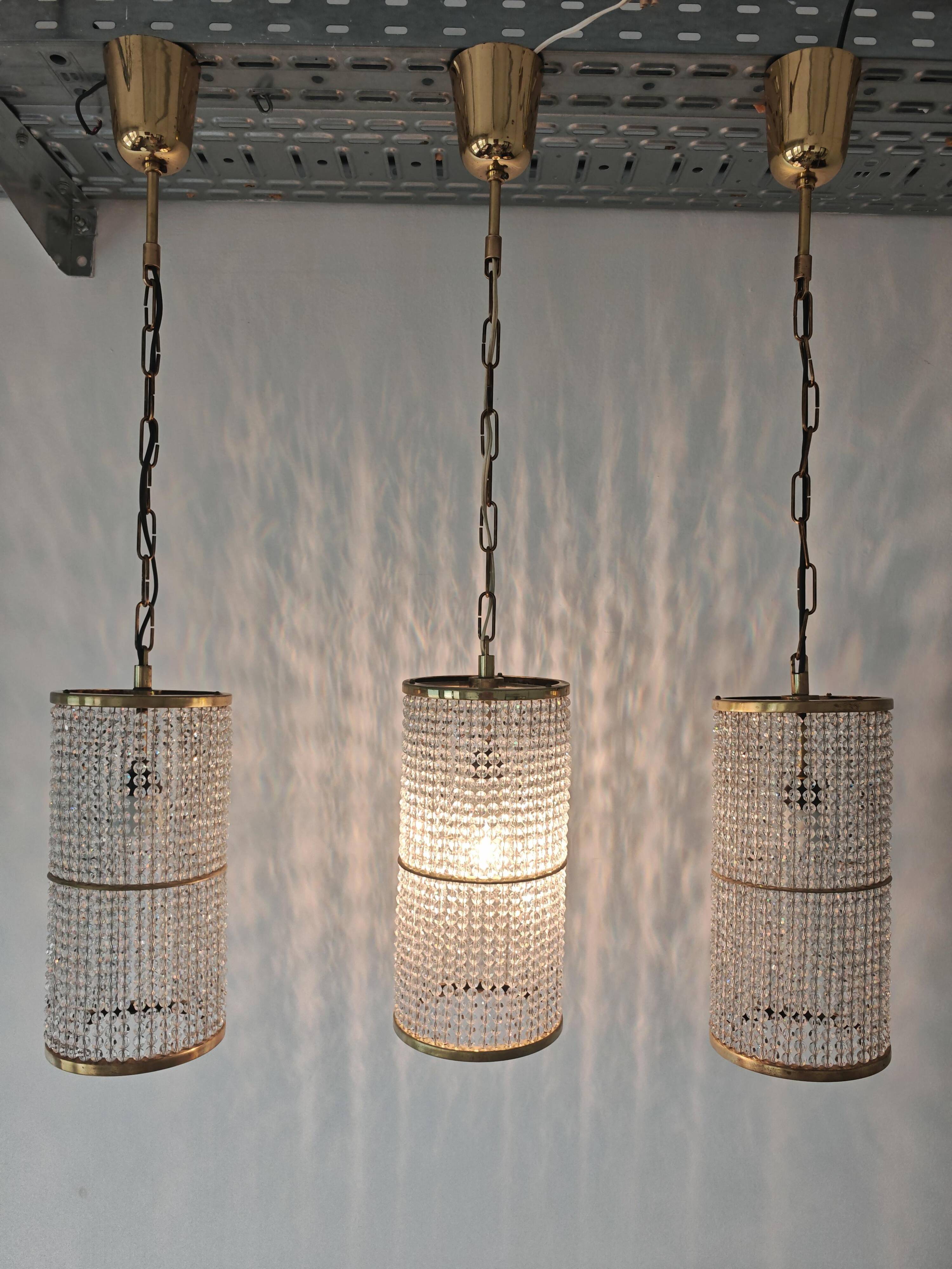 Set of 3 cylindrical crystal chandeliers in mid-century modern style attributed to Lobmeyr.