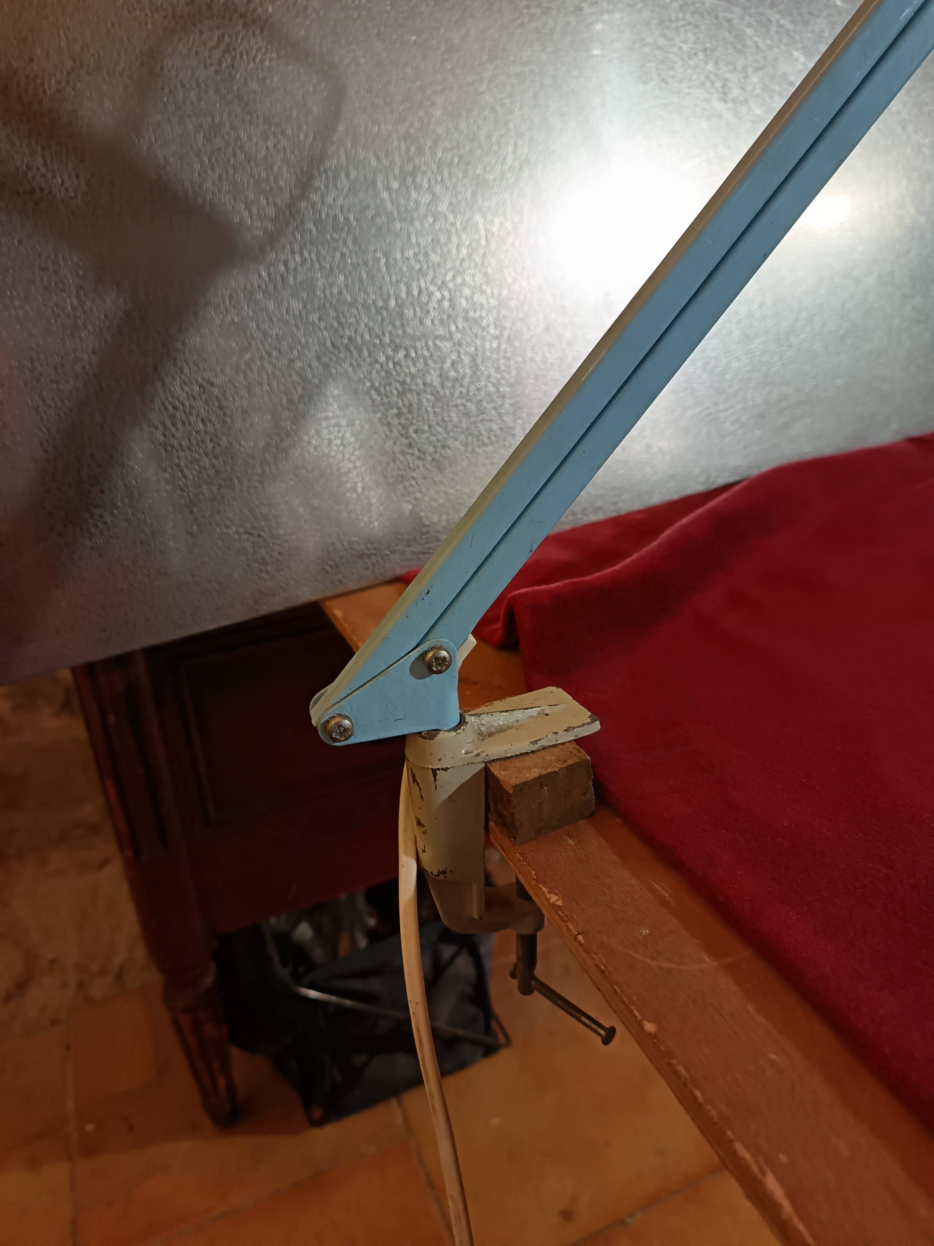 Articulated blue desk lamp