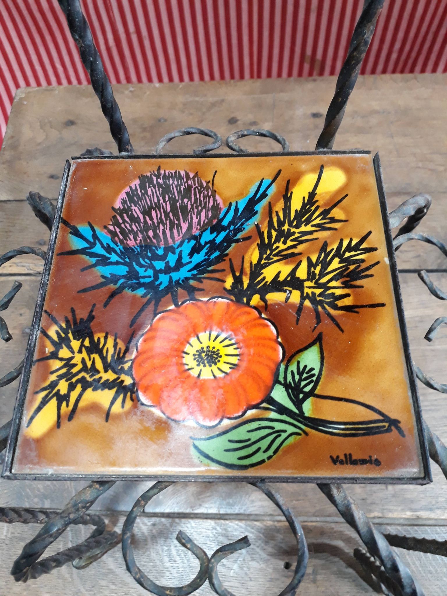 Wrought iron chair with enamelled plate signed Vallauris