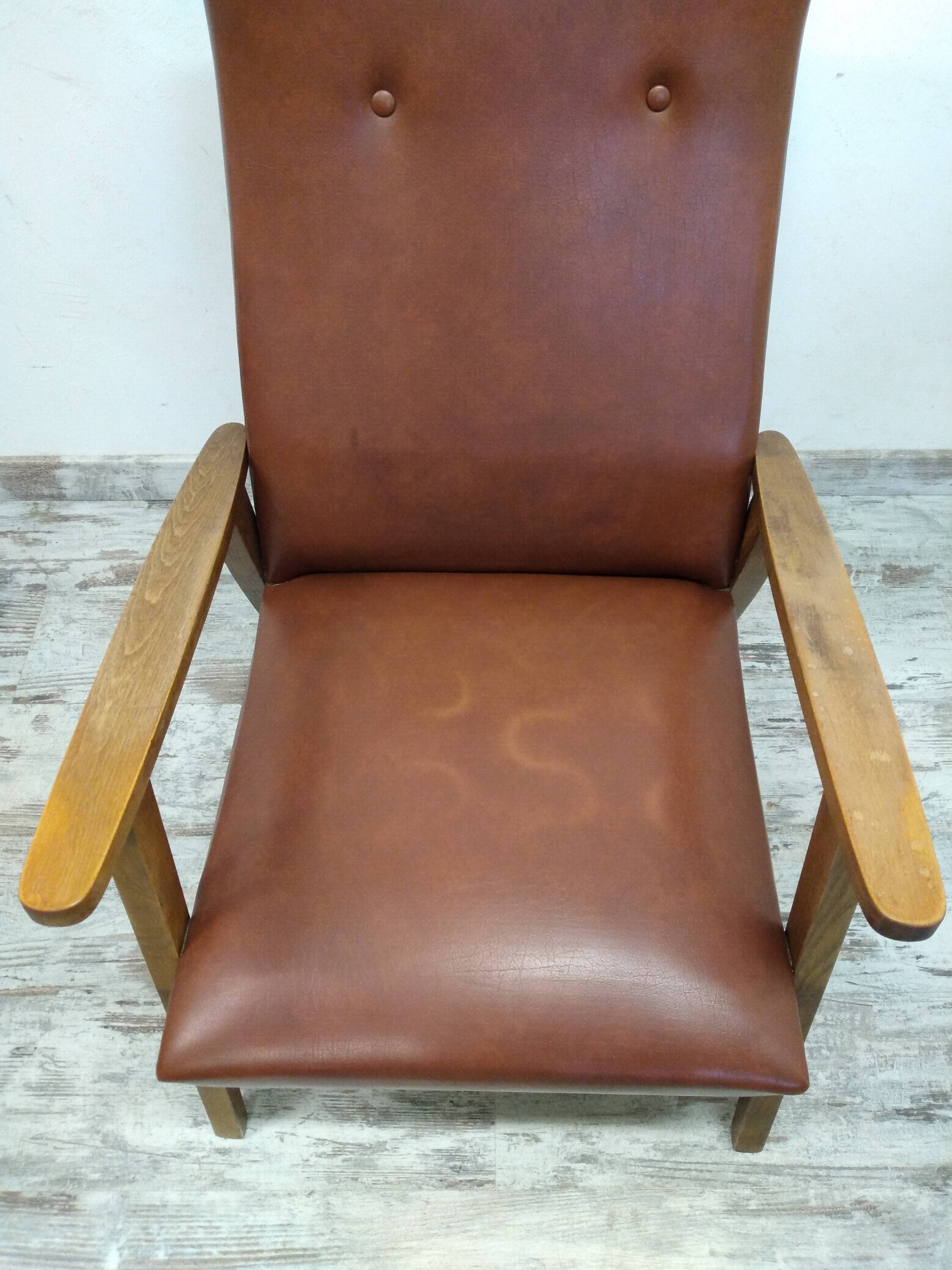Vintage armchair in wood and imitation leather