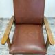 Vintage armchair in wood and imitation leather