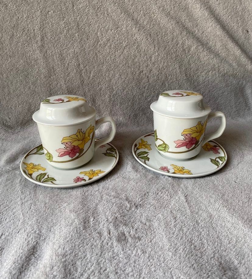 Two cups with herbal tea from the Faiencerie of Pillivuyt