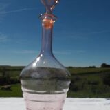 Pink transparent glass carafe with bubble cap