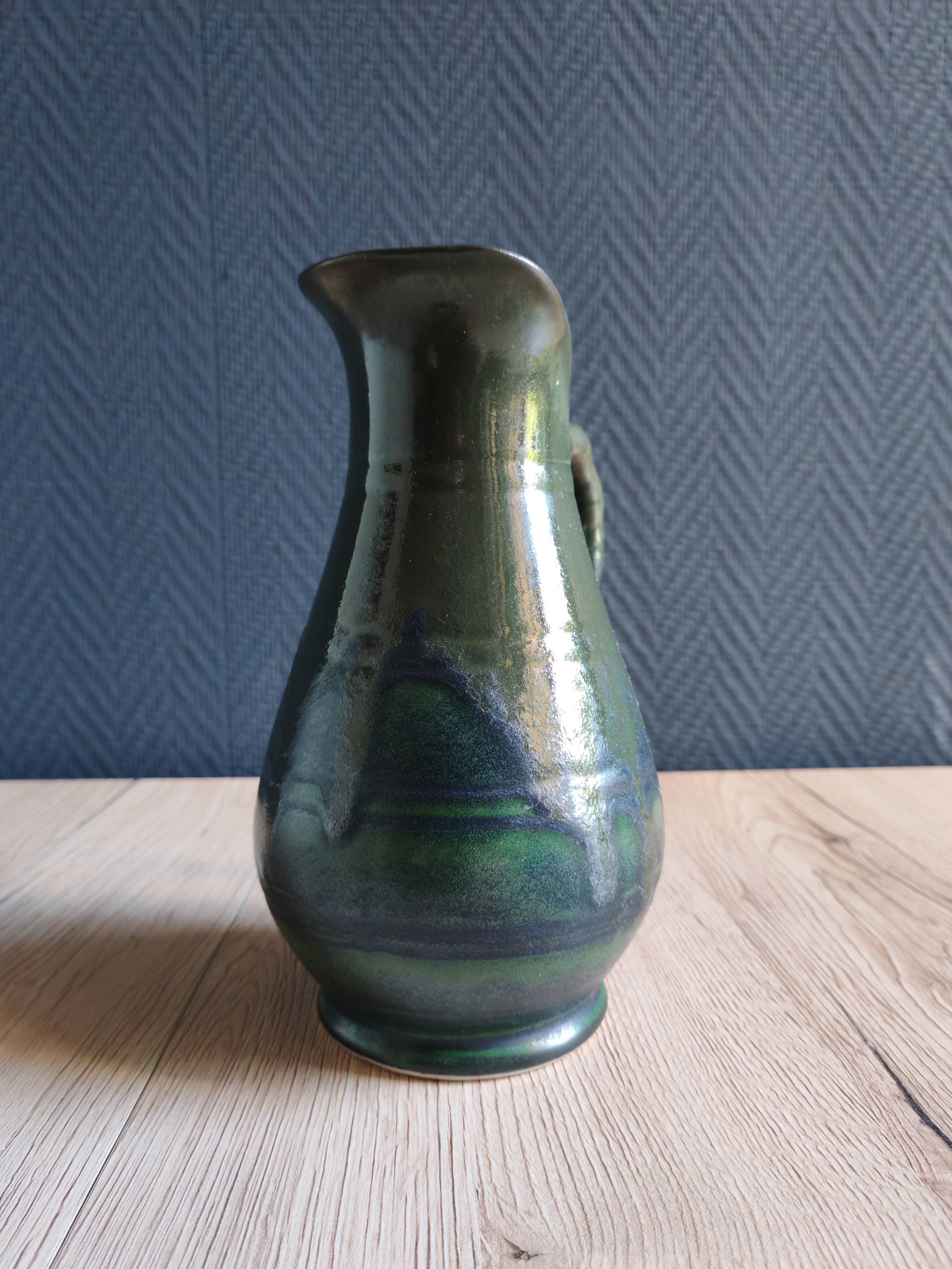 Vintage ceramic pitcher vase in glazed green and blue.