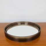 Round mirror with amber rim from the 70s, vintage