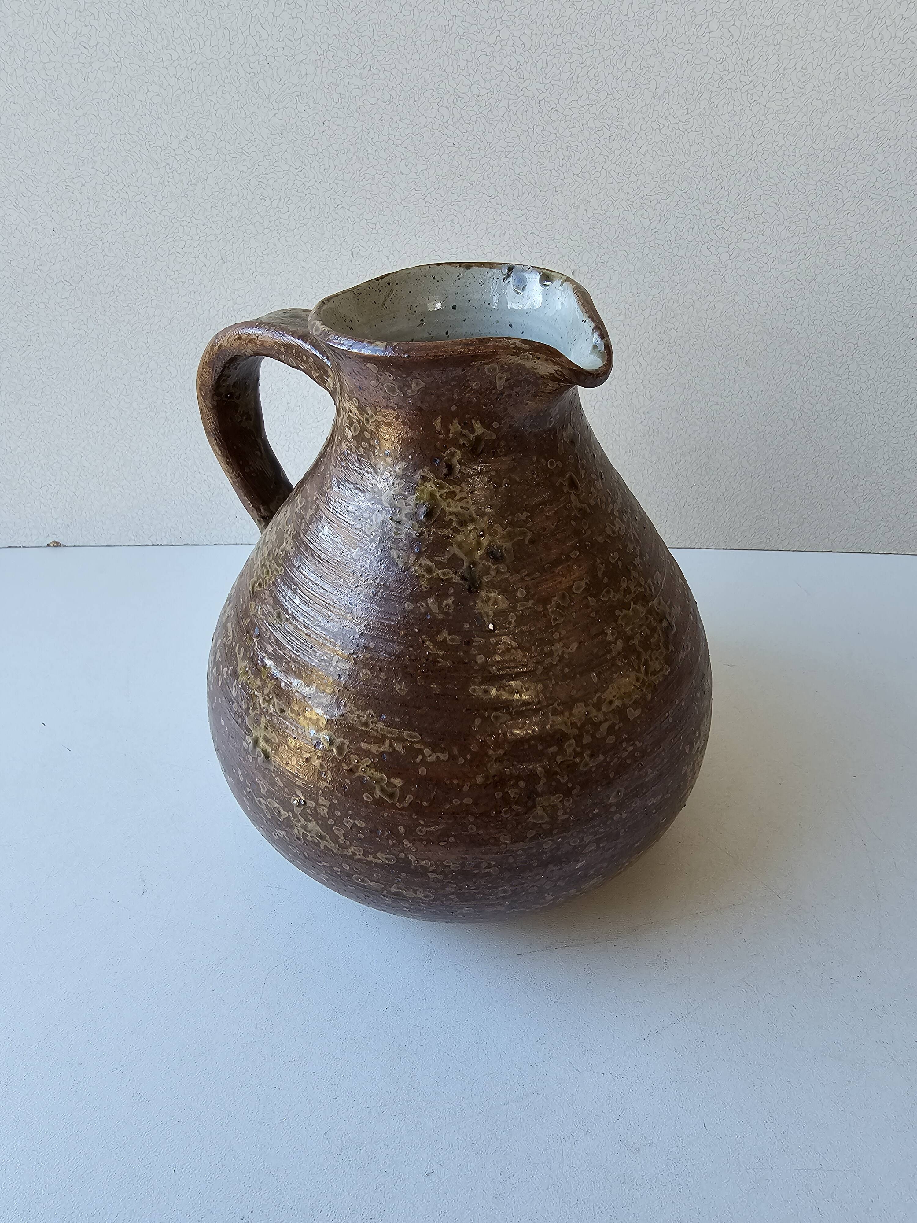 Ceramic stoneware pitcher signed with the Phi pictogram (signature to be identified).