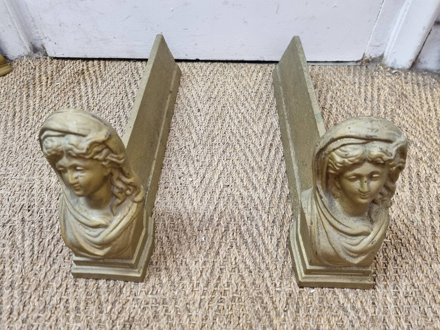 Cast iron andirons heads of women