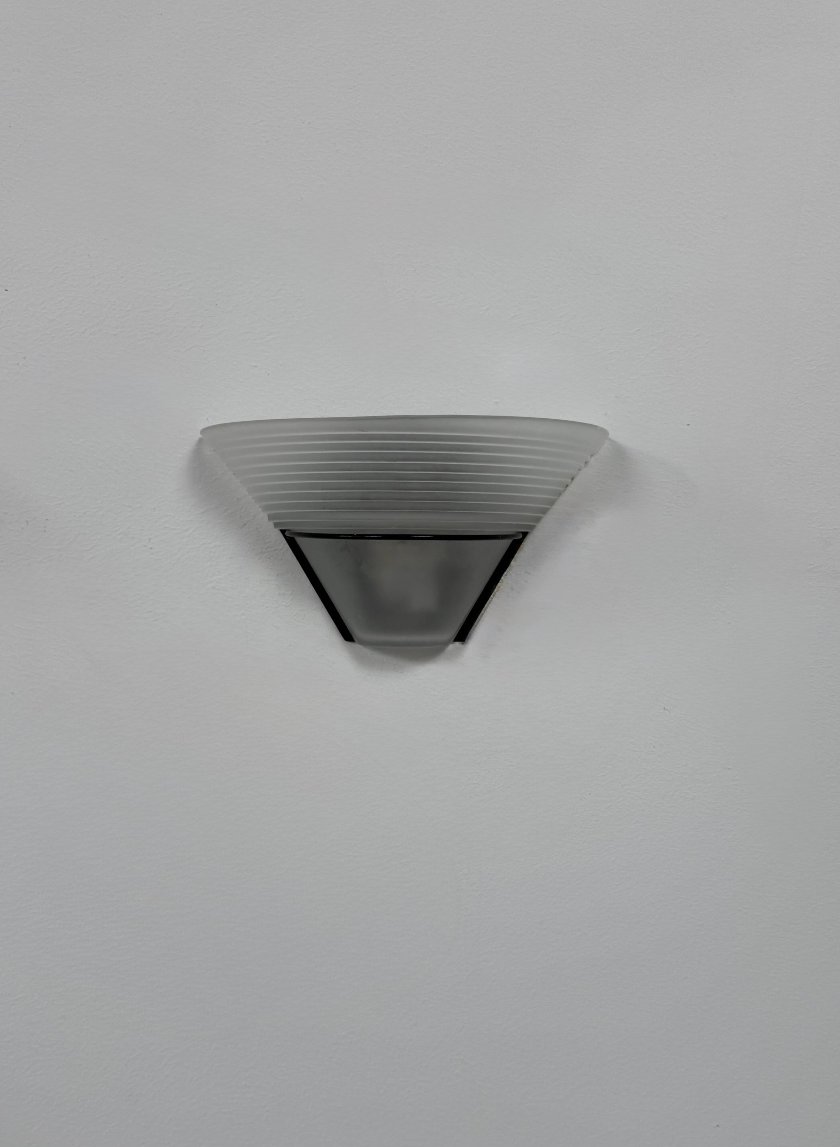 Frosted glass and black metal wall light, Italy, 1980.