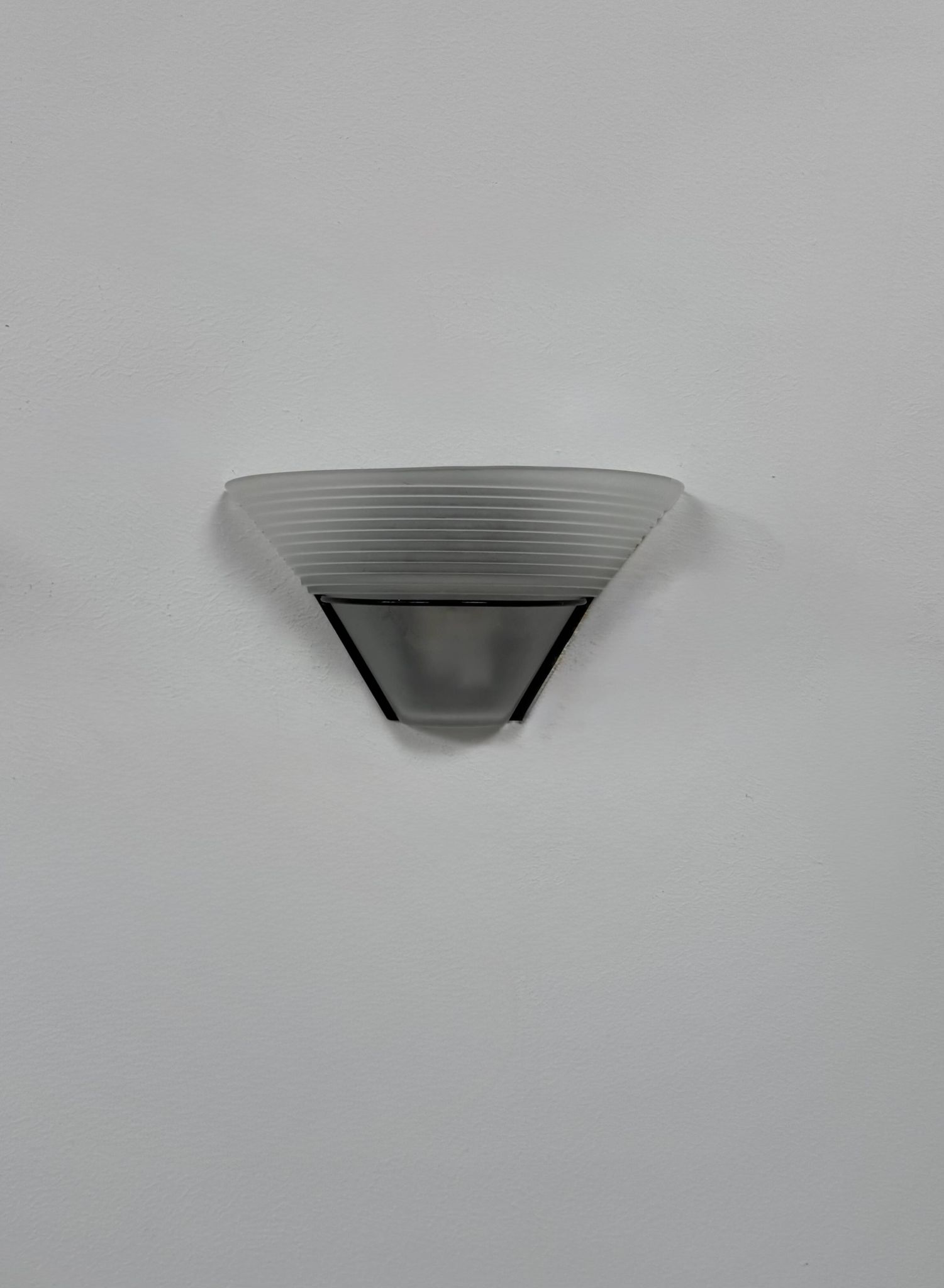 Frosted glass and black metal wall light, Italy, 1980.