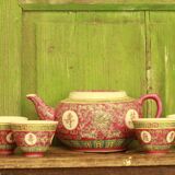 Chinese pink mu shou teapot and its cups