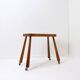 Vintage solid wood side table on casters