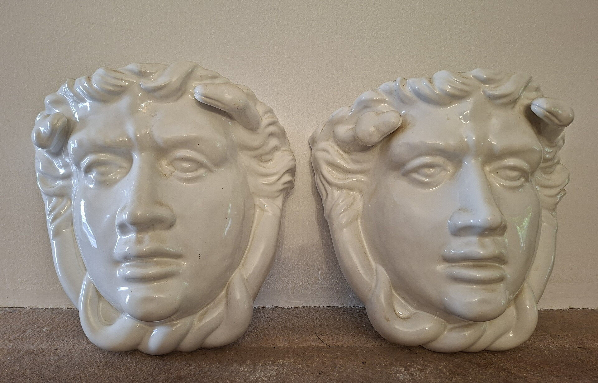 Pair of white glazed ceramic wall planters