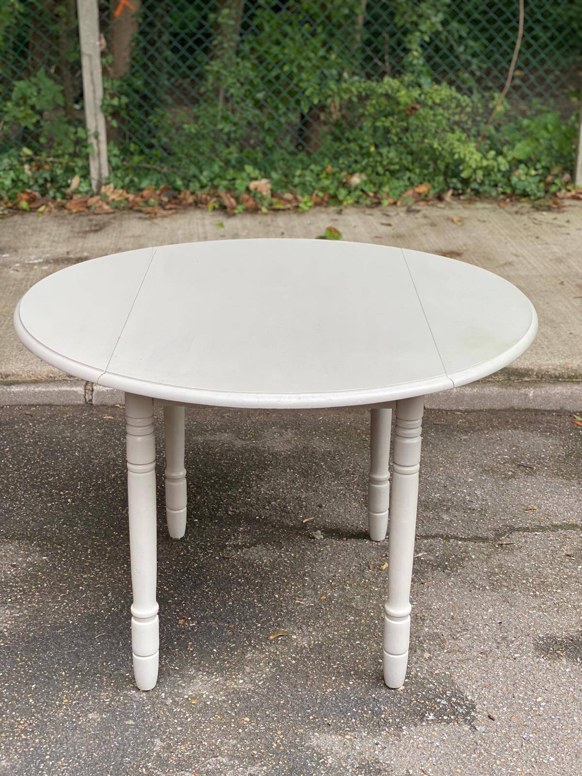 Louis Philippe round dining table with folding shutters repainted in beige grey