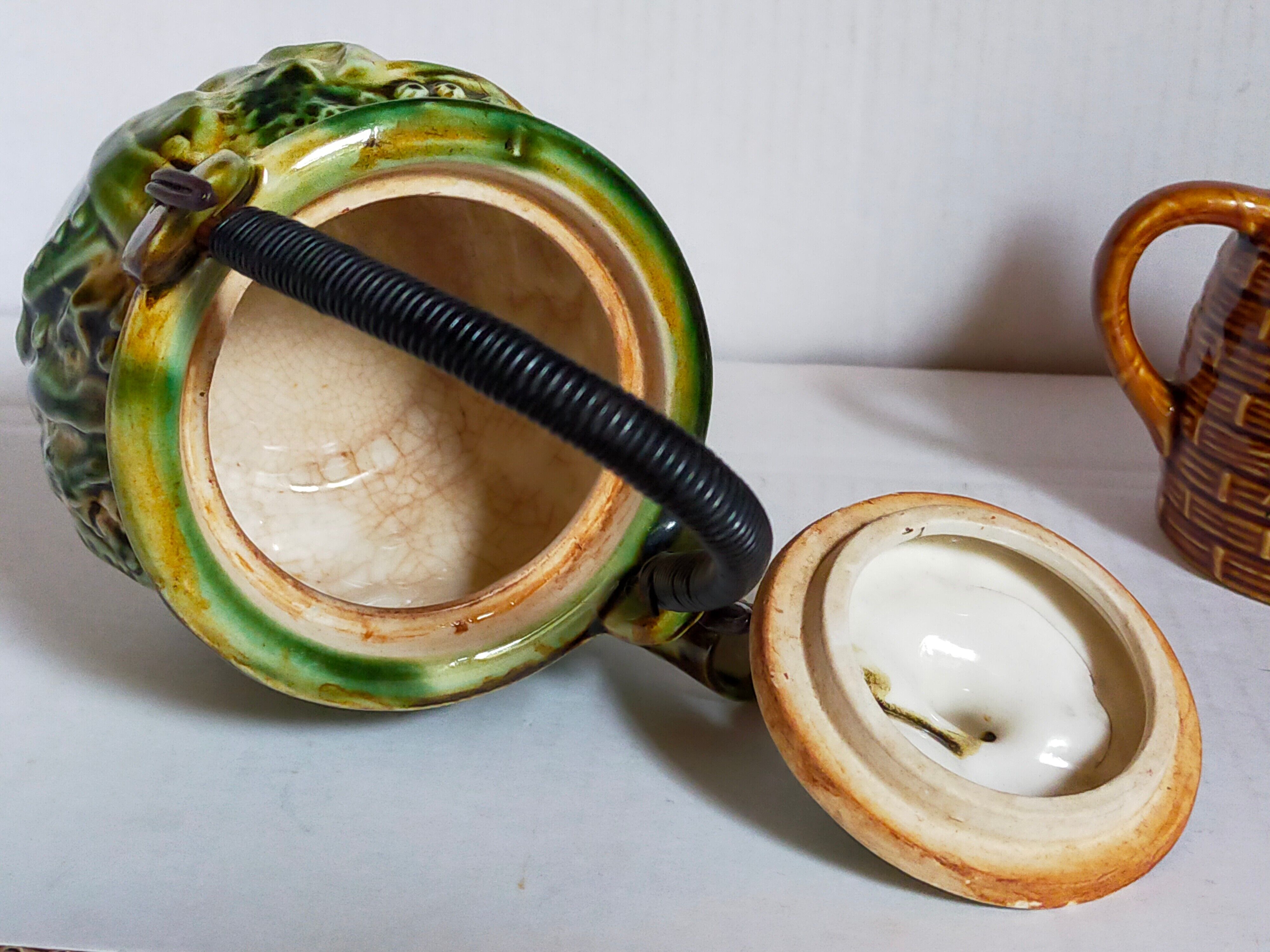 Set of old teapots and honey pot