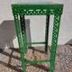 Green metal stool, pedestal table