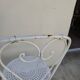 Pair of wrought iron garden chairs, antique manufacture