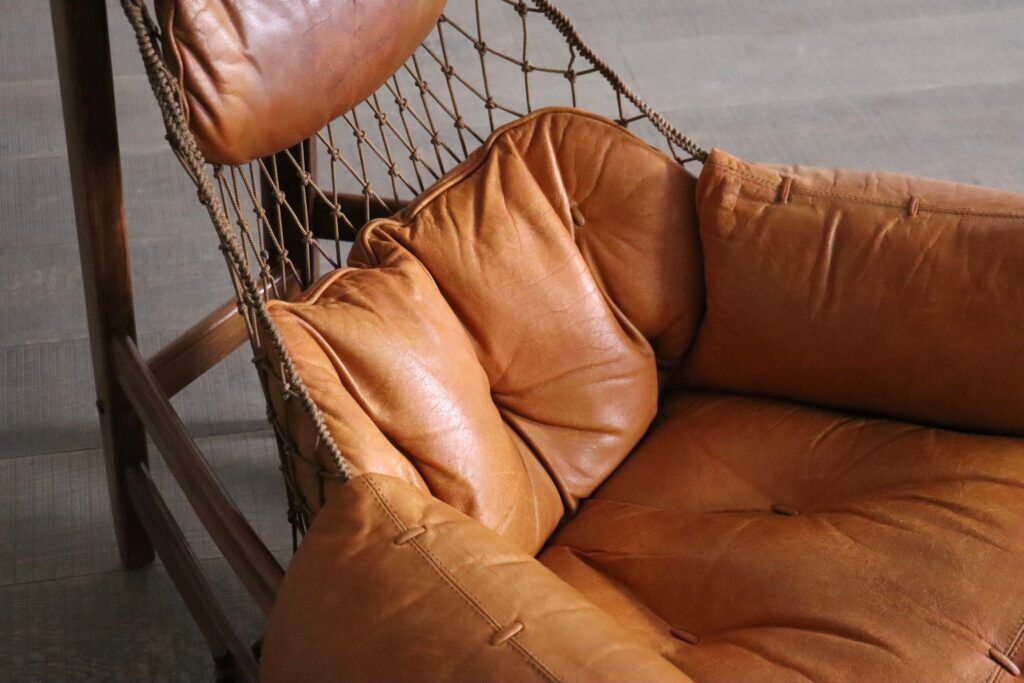Jangada lounge chair with ottoman in cognac leather by Jean Gillon, Brazil, 1960s