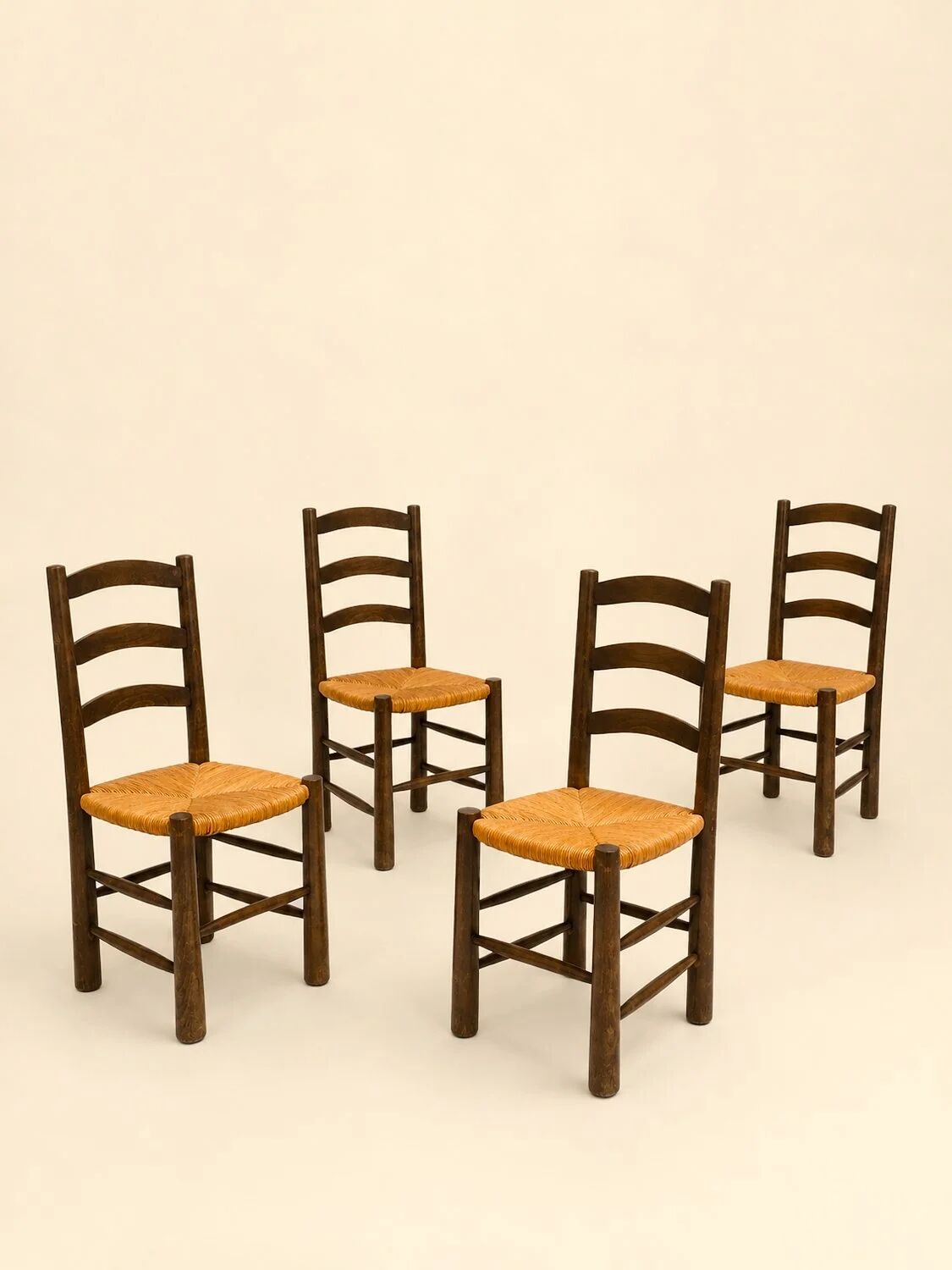 Set of four chairs in the style of Perriand.