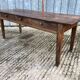 Antique chestnut farmhouse table with 3 drawers on the front.