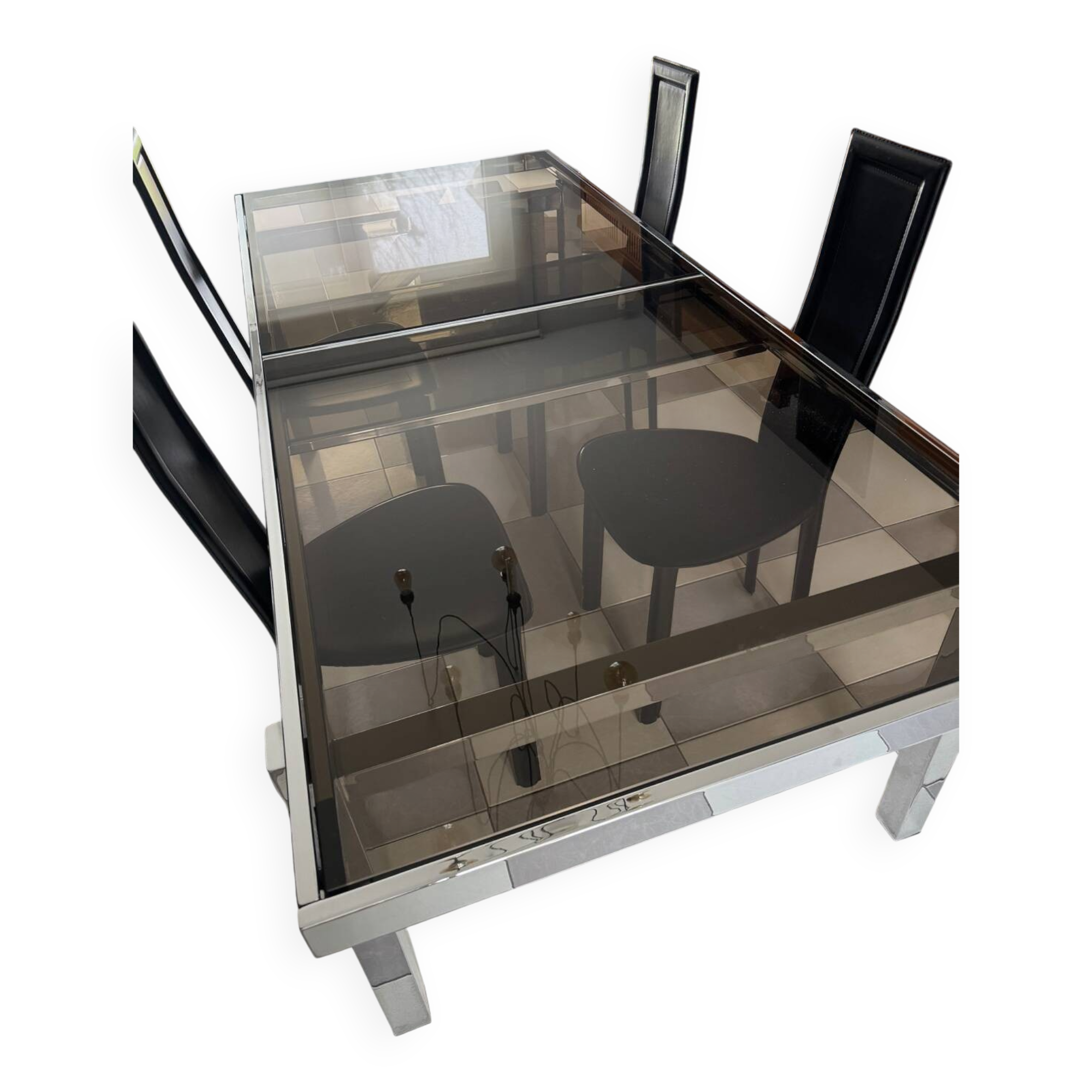 Vintage Roche Bobois dining table with smoked glass and 4 leather chairs.
