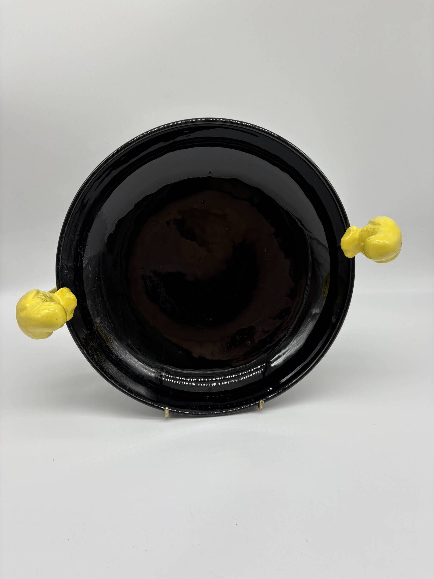 Large vintage black ceramic bowl with yellow parakeets, Vallauris.