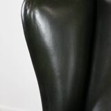 Smooth classic cowhide Chesterfield armchair in a stylish dark green color