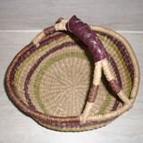 Round and colorful straw basket with handles